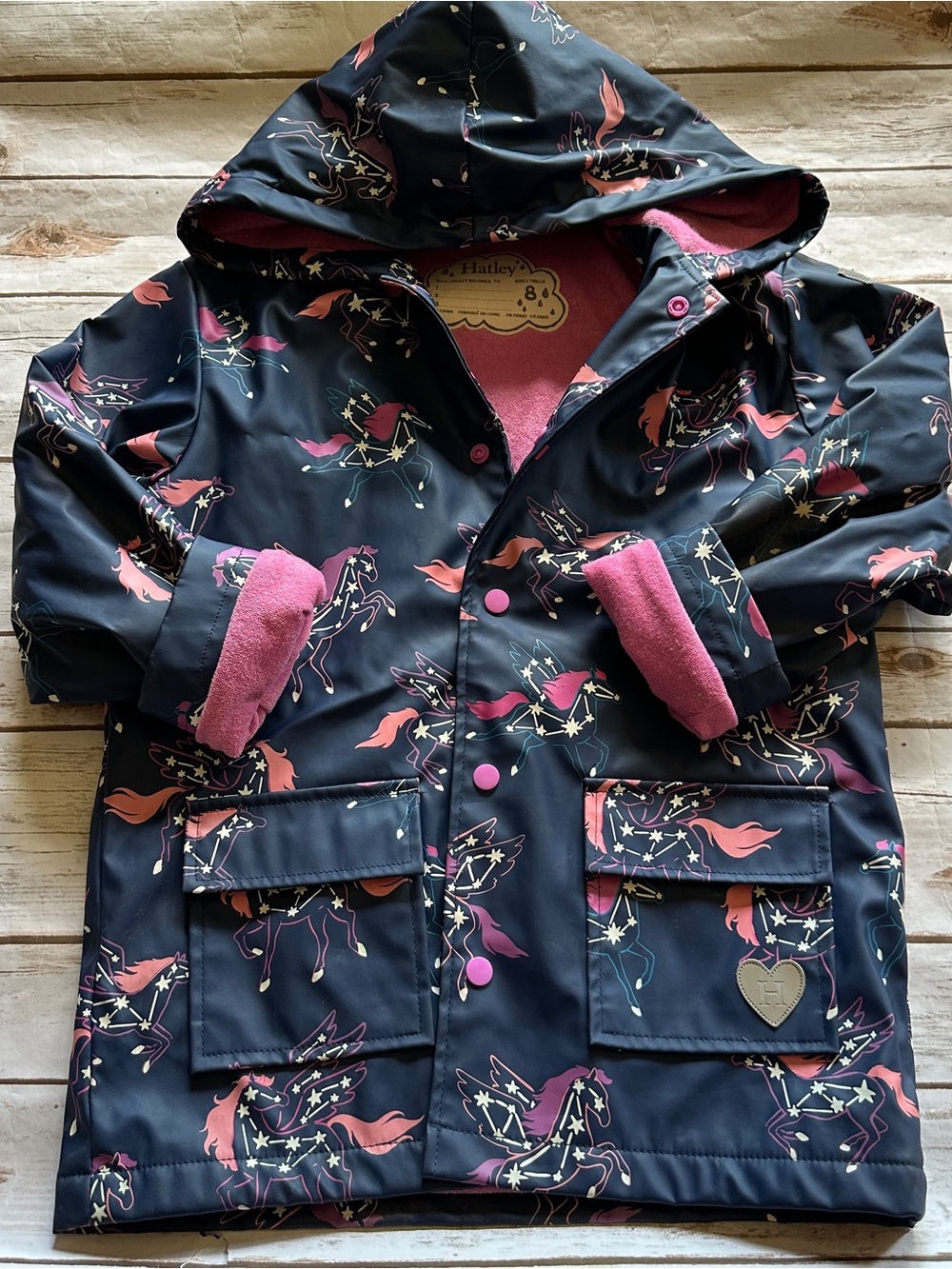 Hatley unicorn raincoat fair stains and wear 8y